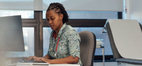 Female doctor at desktop computer